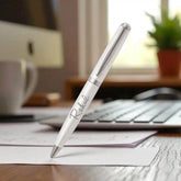Sleek white and silver personalized pen with elegant accents, ideal for gifting or professional use.